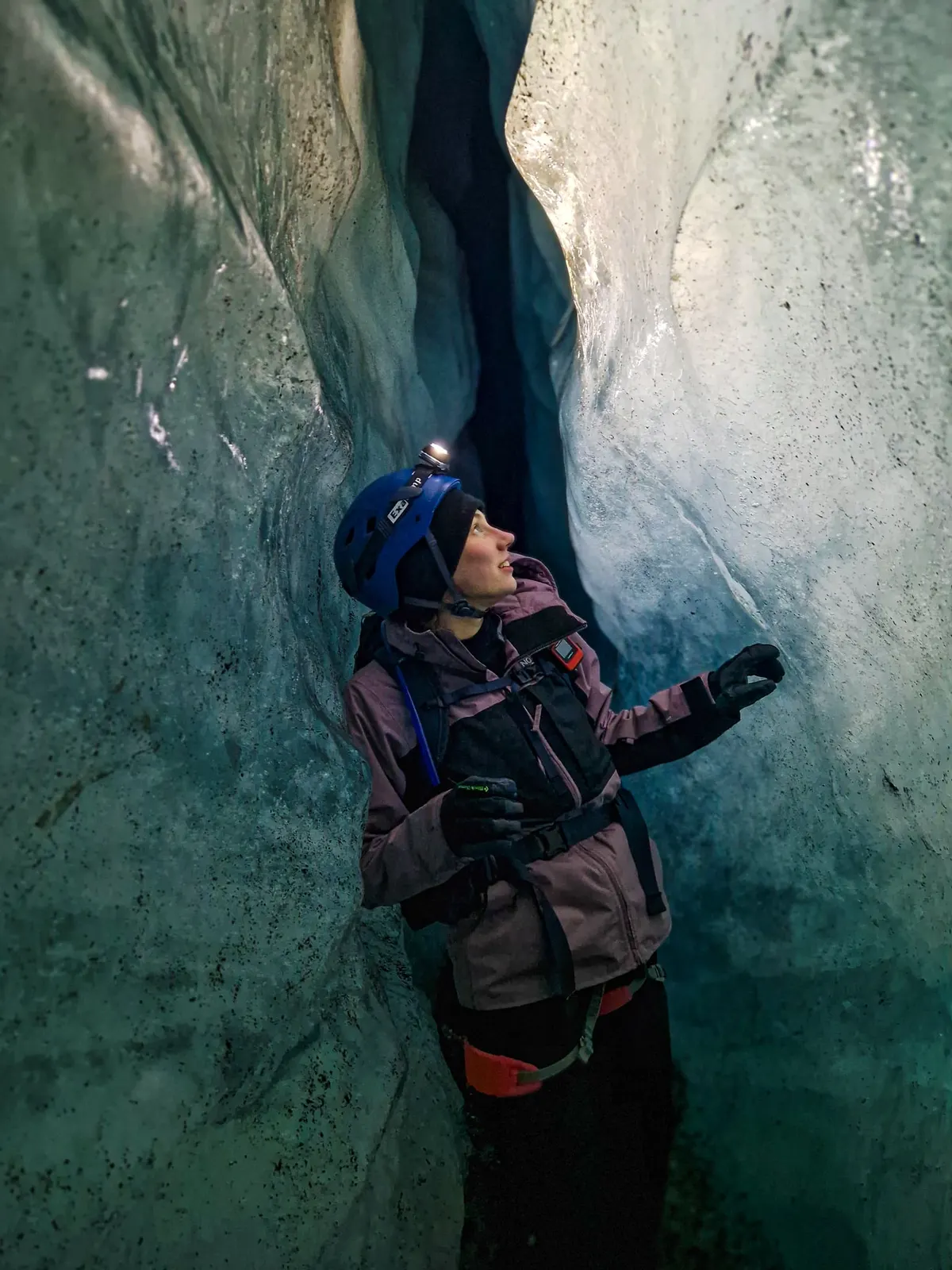 Erin exploring an ice cave in Iceland - local glacier guide